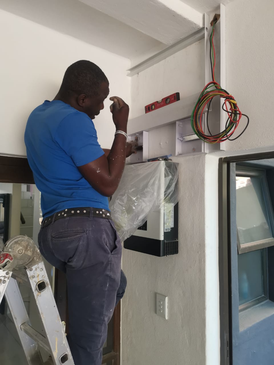 worker installing inverter